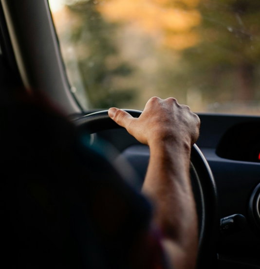 person driving car during daytime