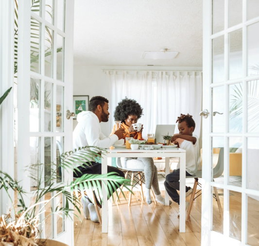 people sitting on chairs in front of table